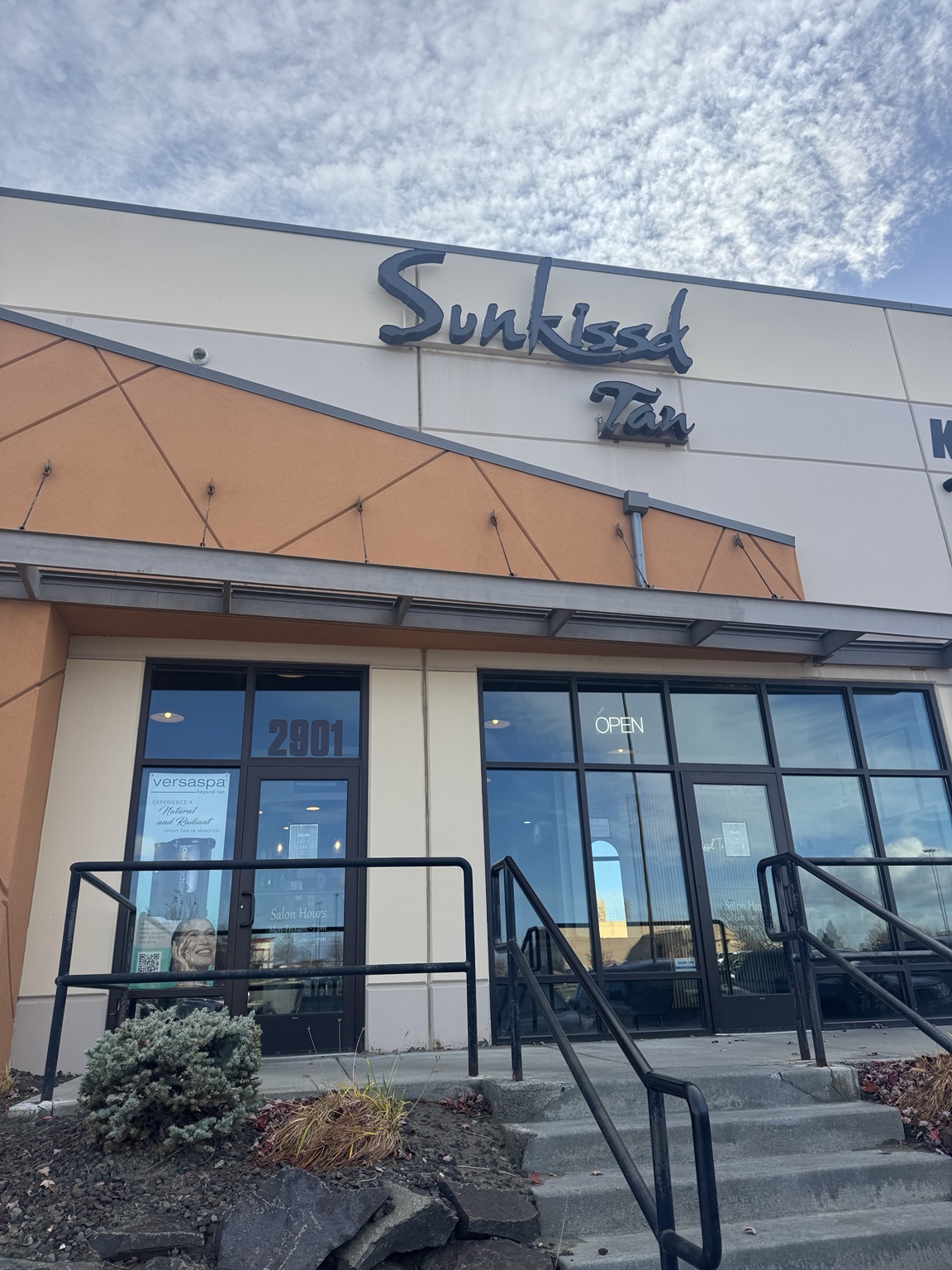 Sunkissd Tan exterior sign and glass entrance at 2901 Duportail Street